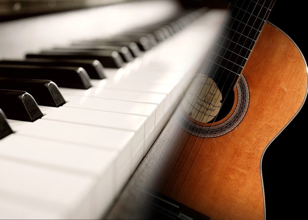 learn guitar vs. piano
